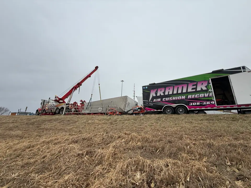 Rotator recovering a trailer in a field